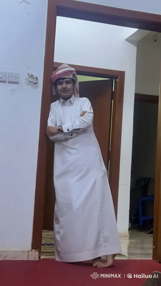 Young Man in White Attire Smokes Casually in Doorway – AI Generated Video | Hailuo AI