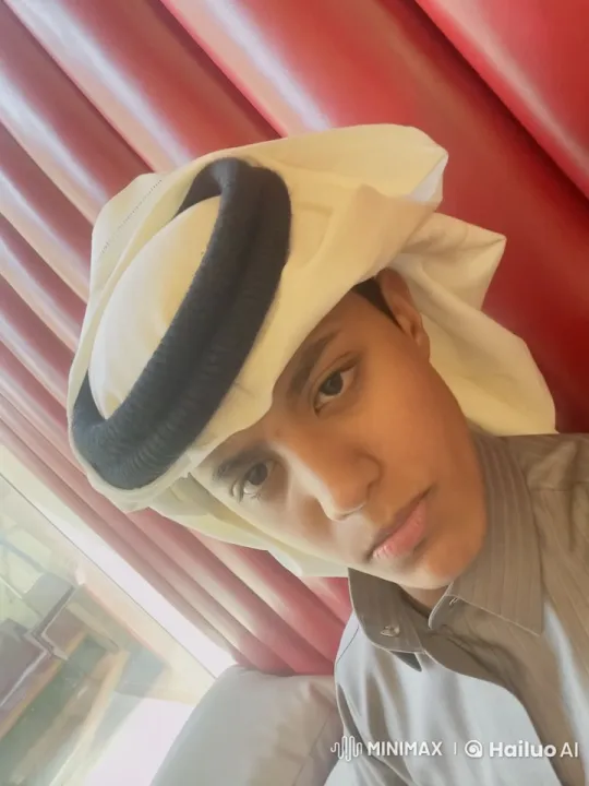 Young Man in Traditional Attire Contemplates with a Cigarette – AI Generated Video | Hailuo AI