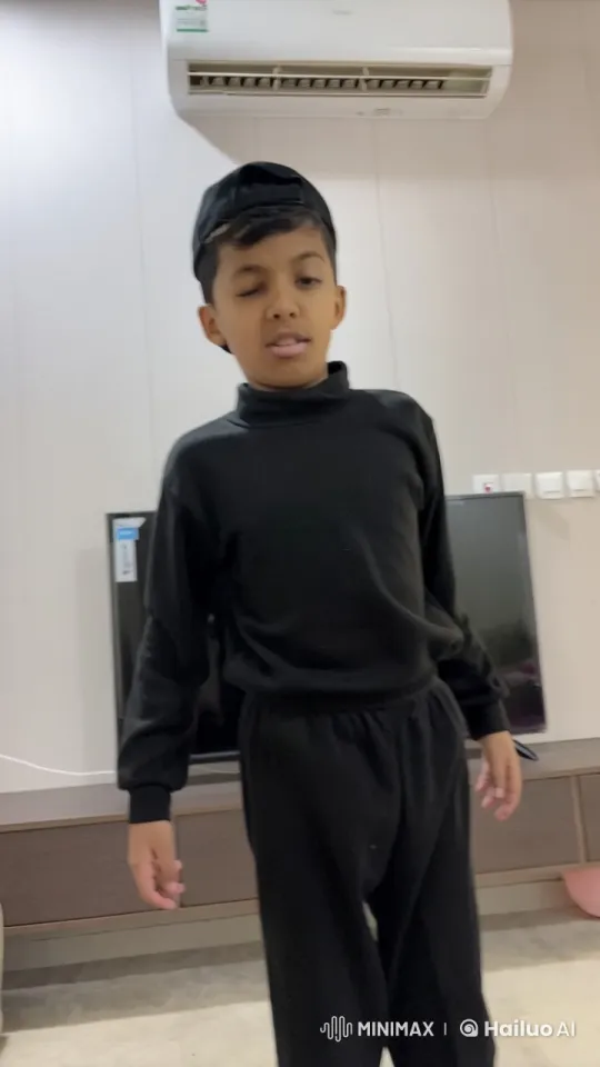 Young Boy Mimics Smoking in a Calm Room Setting – AI Generated Video | Hailuo AI