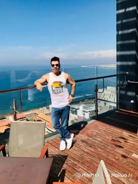 Man on Balcony Enjoying Ocean View – AI Generated Video | Hailuo AI