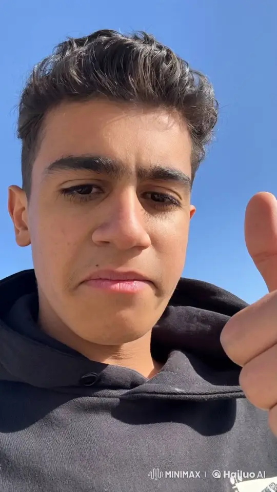 Young Man Enjoying a Cigarette with a Thumbs-Up – AI Generated Video | Hailuo AI