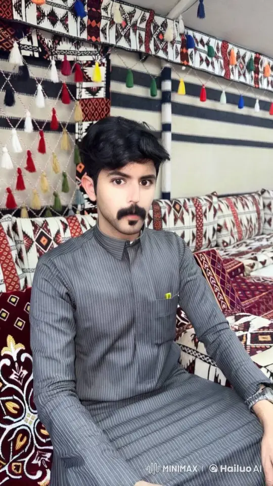 Contemplative Man in Traditional Attire Amidst Serene Smoke and Tassels – AI Generated Video | Hailuo AI