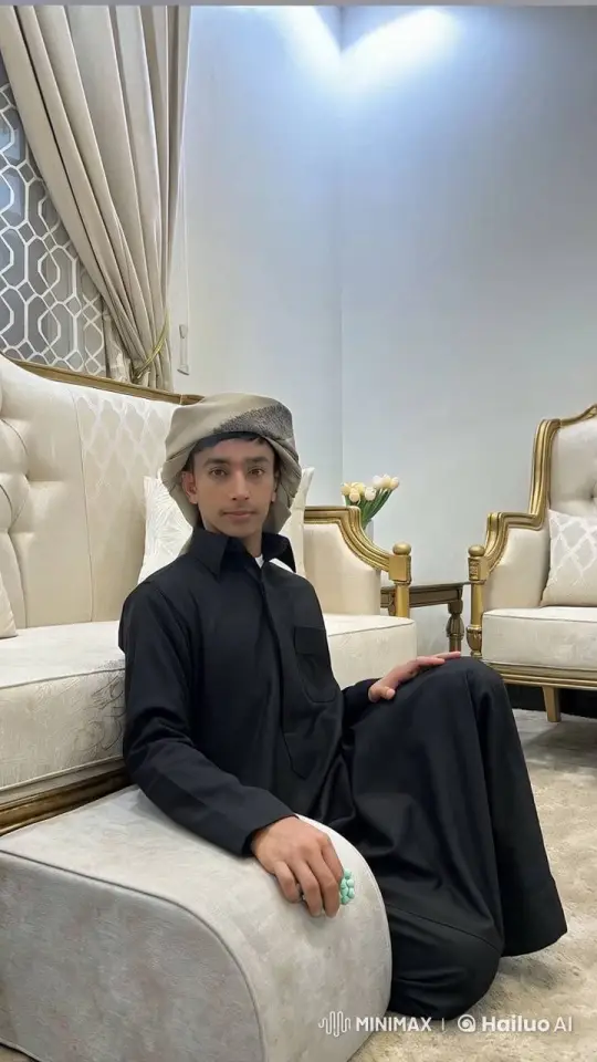 Traditional Attired Person Reflects in Luxurious Living Room – AI Generated Video | Hailuo AI