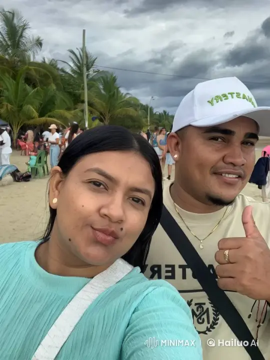 Couple Shares Affectionate Moment on Crowded Beach – AI Generated Video | Hailuo AI
