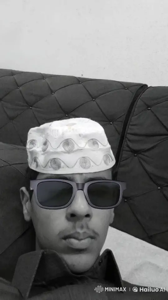 Young Man Smoking Calmly on Cushioned Surface – AI Generated Video | Hailuo AI