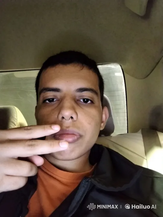 Young Man Smoking in Dimly Lit Car Interior – AI Generated Video | Hailuo AI