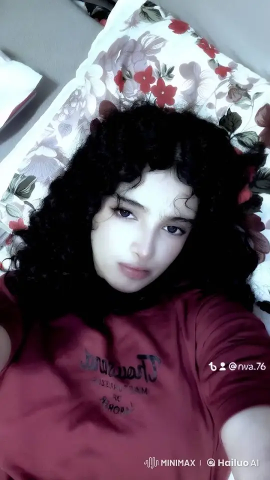Contemplative Smoking Scene with Floral Pillow Background – AI Generated Video | Hailuo AI