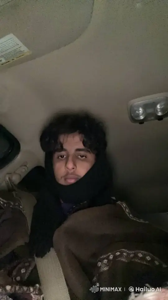 Young Man Reflects Smoking in Dimly Lit Car at Night – AI Generated Video | Hailuo AI