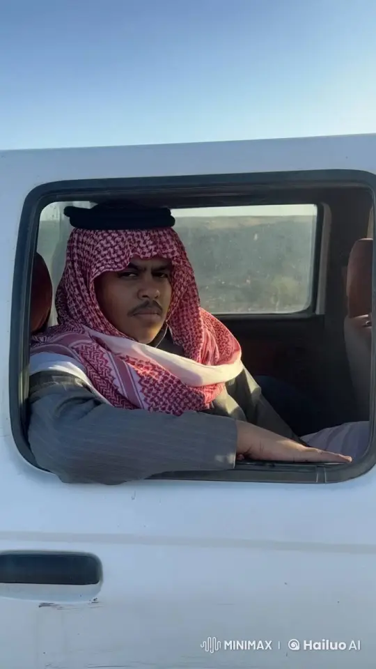 Traditional Attired Person Smokes in Desert Car Scene – AI Generated Video | Hailuo AI