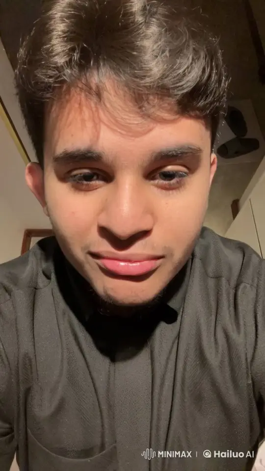 Young Man Smoking Calmly in Dim Light – AI Generated Video | Hailuo AI