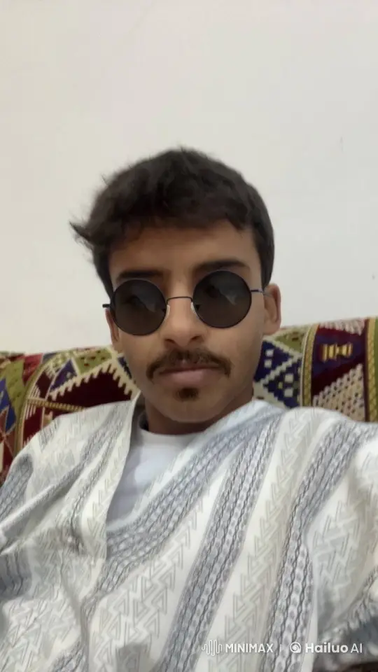 Young Man Smoking on Patterned Couch – AI Generated Video | Hailuo AI