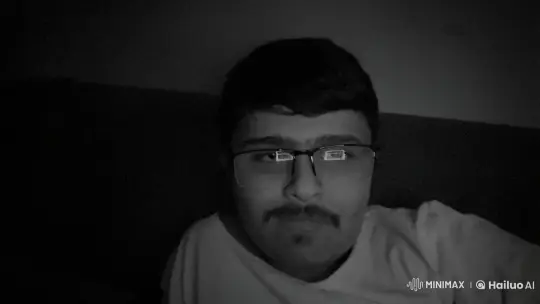 Young Man Smoking in Dim Light with Reflective Glasses – AI Generated Video | Hailuo AI