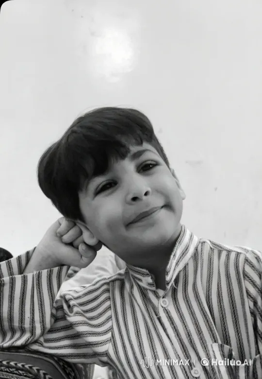 Boy in Striped Shirt: A Study in Serenity – AI Generated Video | Hailuo AI
