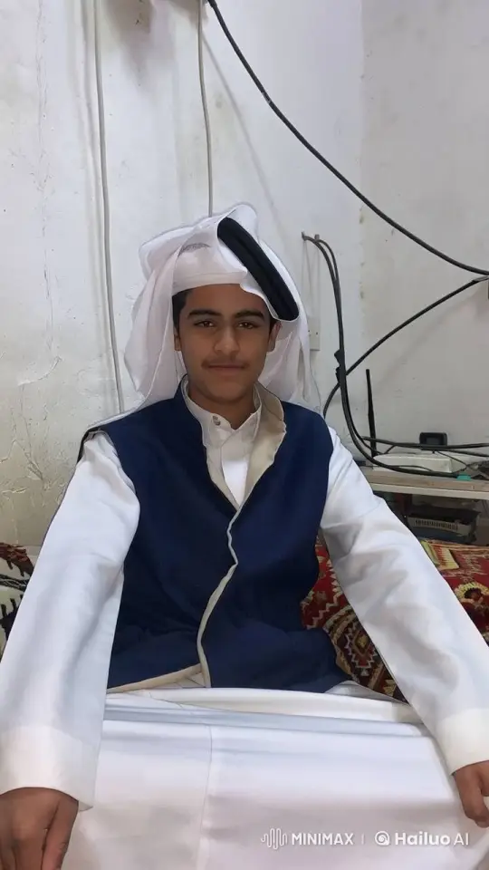 Young Man in Traditional Attire Sitting Calmly – AI Generated Video | Hailuo AI
