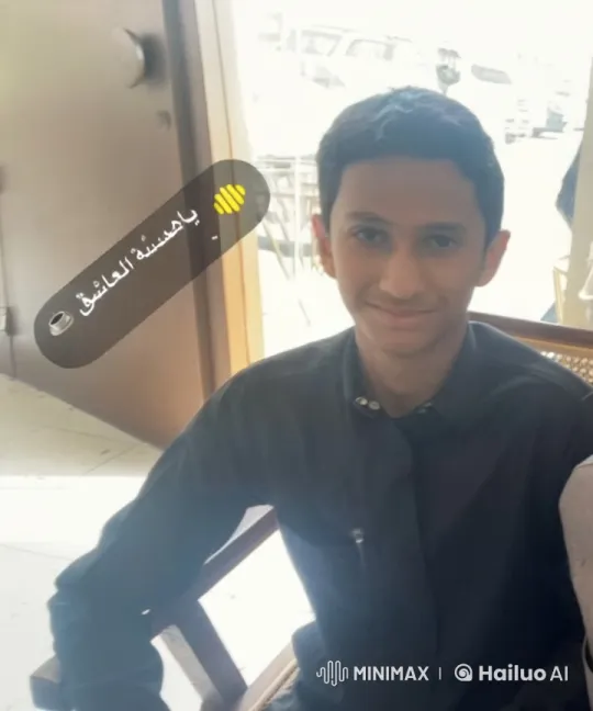 Young Man Smoking in Daylit Café Setting – AI Generated Video | Hailuo AI