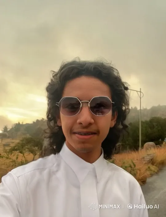 Young Man Smoking in Tranquil Outdoor Setting – AI Generated Video | Hailuo AI