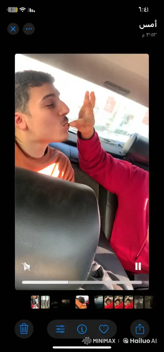 Inside Car: Two Individuals Sharing a Cigarette – AI Generated Video | Hailuo AI