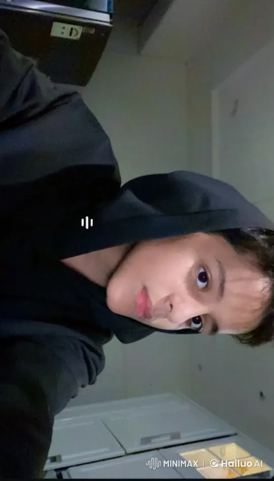Contemplative Person Smokes in Dimly Lit Room – AI Generated Video | Hailuo AI