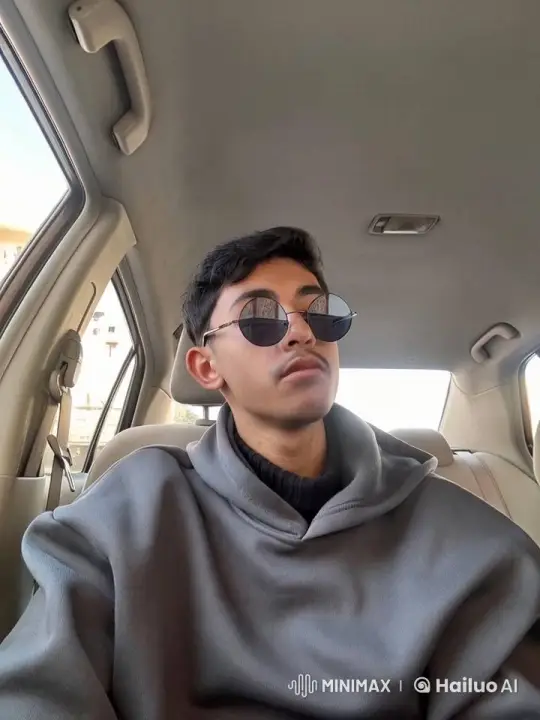 Young Man in Car Contemplatively Smoking – AI Generated Video | Hailuo AI