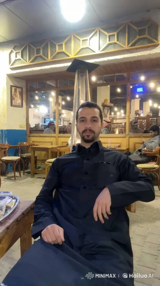 Man Relaxing with Cigarette in Cozy Café – AI Generated Video | Hailuo AI