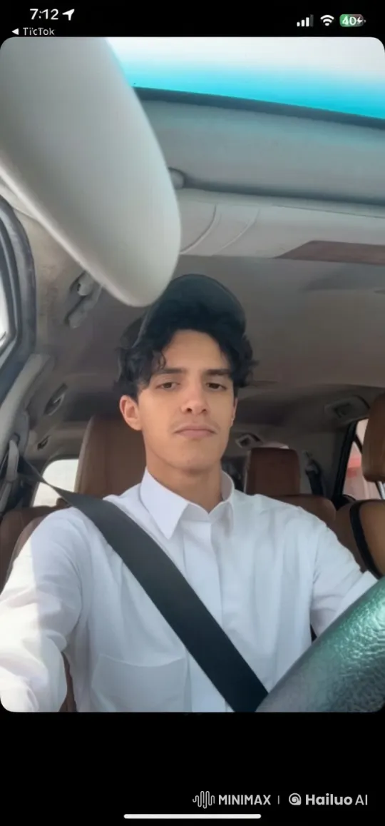Young Man Smoking Calmly in Parked Car – AI Generated Video | Hailuo AI