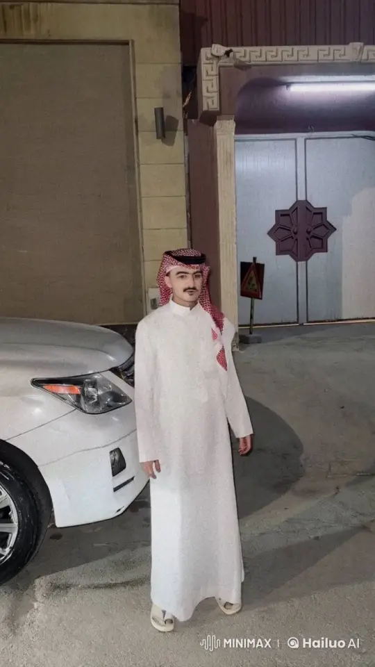 Young Man in Traditional Attire Smokes Near Car at Night – AI Generated Video | Hailuo AI