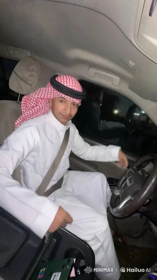 Young Man Smoking in Car with Traditional Attire – AI Generated Video | Hailuo AI