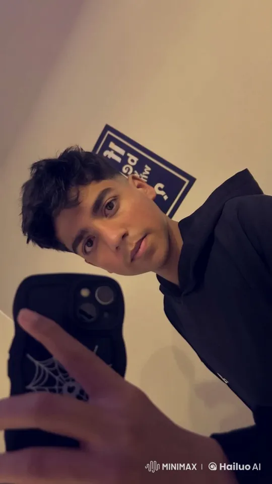 Young Man Smoking Calmly, Taking Selfie – AI Generated Video | Hailuo AI