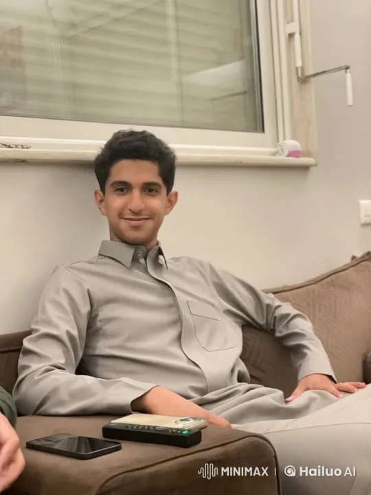 Young Man Relaxing and Smoking on Couch – AI Generated Video | Hailuo AI