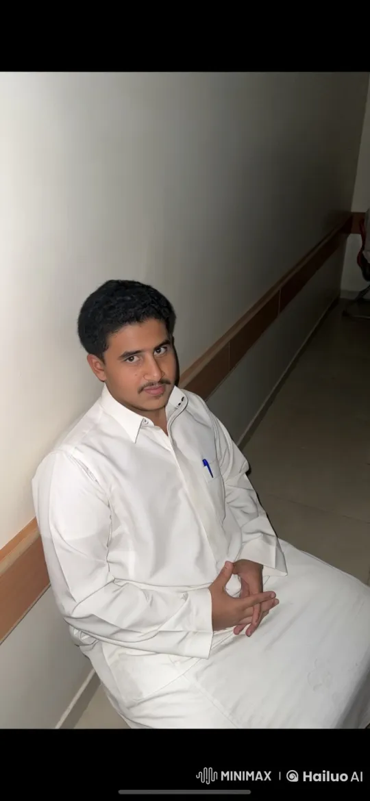 Young Man Calmly Smokes in Hallway Setting – AI Generated Video | Hailuo AI