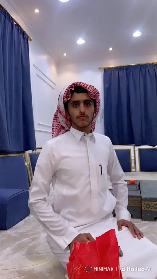 Young Man in Traditional Attire Smokes in Blue-Room – AI Generated Video | Hailuo AI