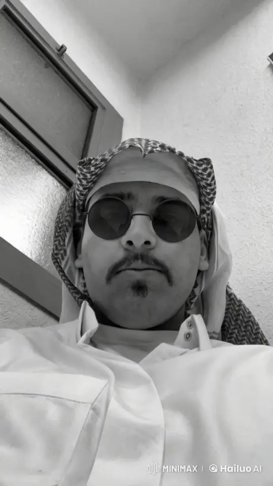 Man in Traditional Headwear Smoking Calmly – AI Generated Video | Hailuo AI