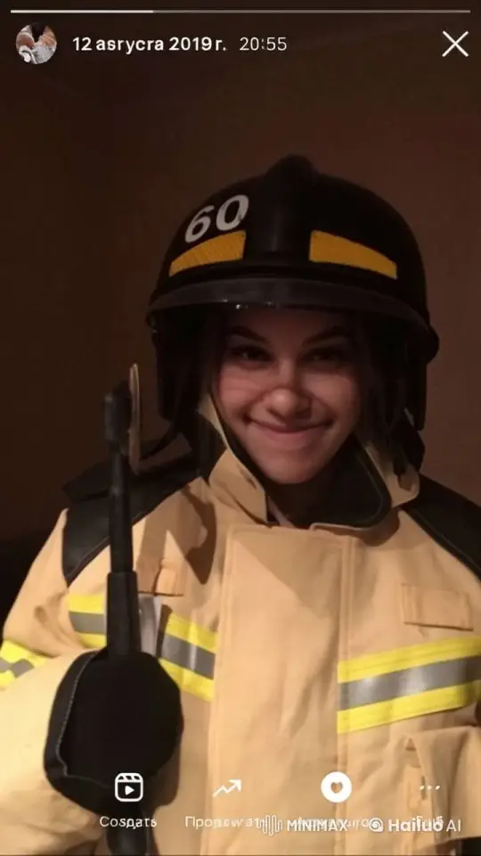 Young Firefighter Poses with Tool, Smiling and Shifting – AI Generated Video | Hailuo AI
