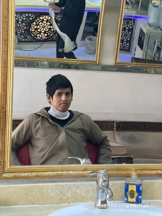 Young Man Reflects in Mirror Amidst Quiet Activity – AI Generated Video | Hailuo AI