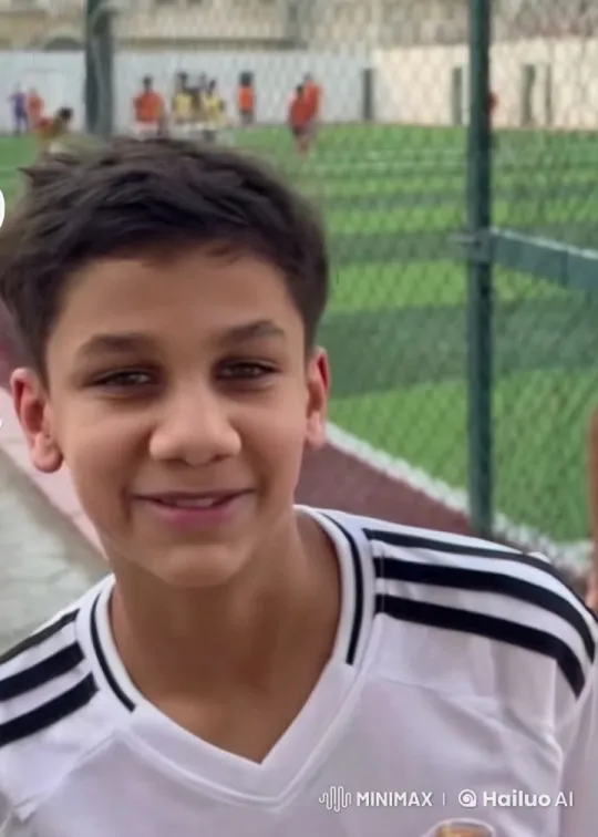 Boy Smokes Cigarette Near Sports Field – AI Generated Video | Hailuo AI