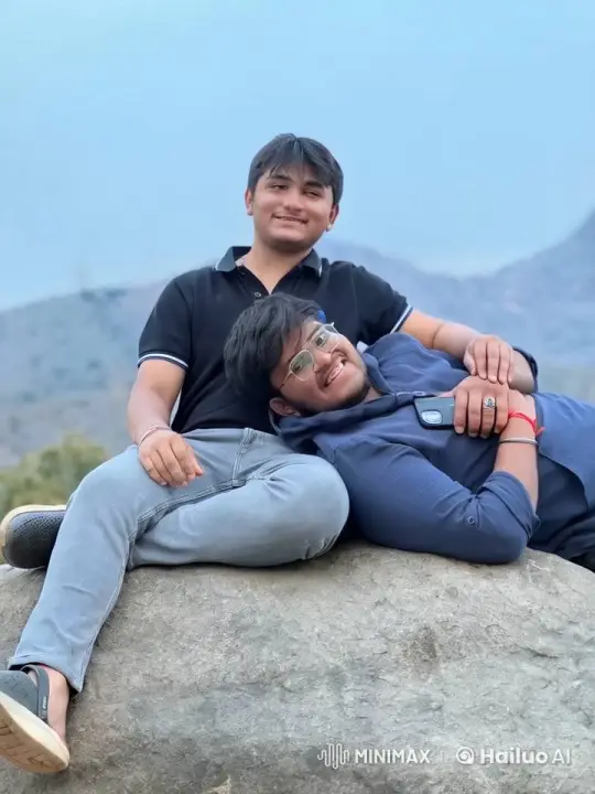 Friends Share Tender Moment on Mountainous Rock – AI Generated Video | Hailuo AI