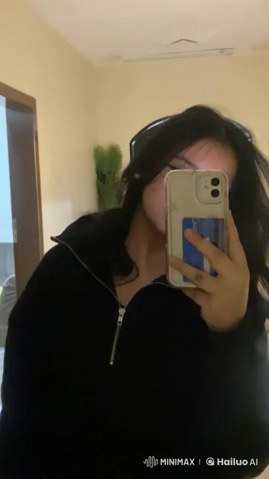 Person Smoking in Dimly Lit Room with Mirror Reflection – AI Generated Video | Hailuo AI