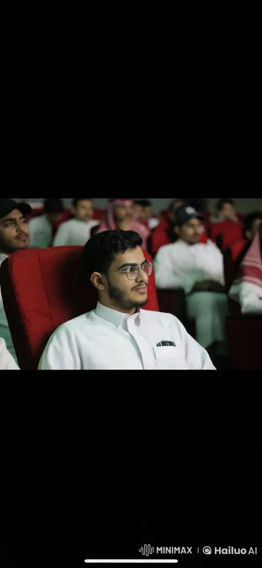 Cinema Attendee Smokes Calmly Amidst Movie Night – AI Generated Video | Hailuo AI