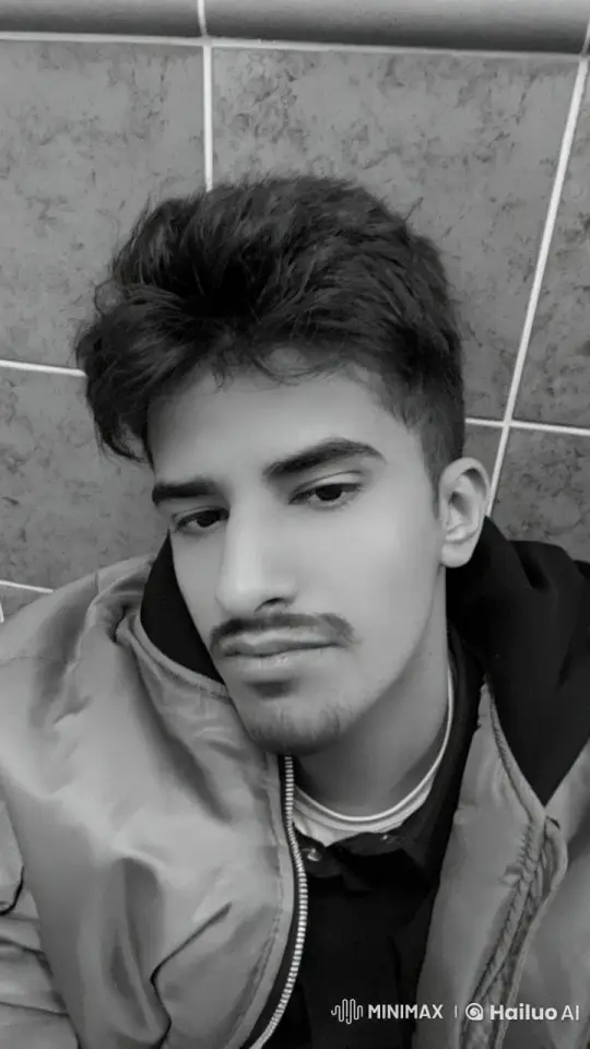 Man Reflects with a Cigarette in Monochrome Setting – AI Generated Video | Hailuo AI