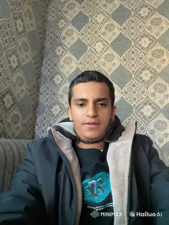 Young Man Smoking on Couch with Patterned Wall – AI Generated Video | Hailuo AI