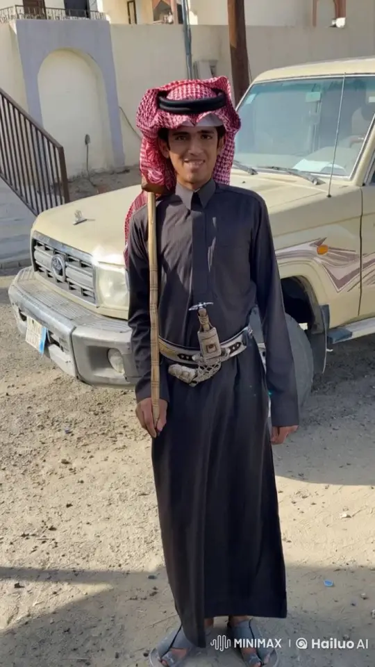 Young Man in Traditional Attire Smokes by Pickup Truck – AI Generated Video | Hailuo AI