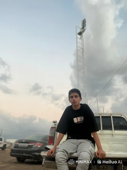 Young Individual Smoking in Overcast Parking Scene – AI Generated Video | Hailuo AI