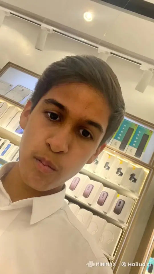 Young Man Smoking in Well-Lit Electronic Store – AI Generated Video | Hailuo AI