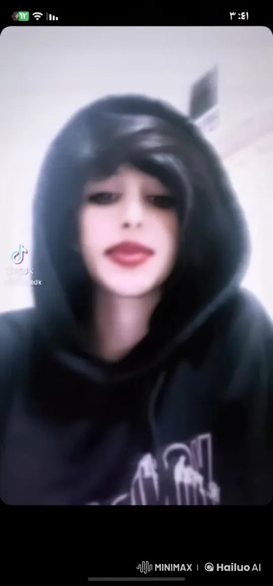 Person in Black Hoodie Smokes Calmly Indoors – AI Generated Video | Hailuo AI