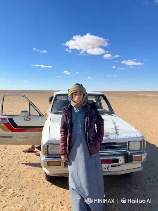 Young Person Smokes in Desert by Old Car – AI Generated Video | Hailuo AI