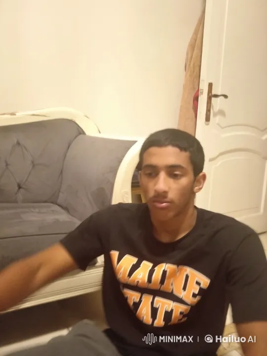 Young Man Simulates Smoking in Peaceful Room – AI Generated Video | Hailuo AI
