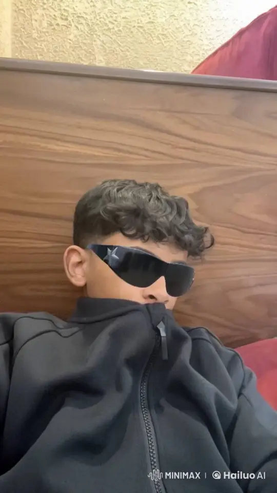 Young Person Relaxing with Sunglasses and Smoking – AI Generated Video | Hailuo AI