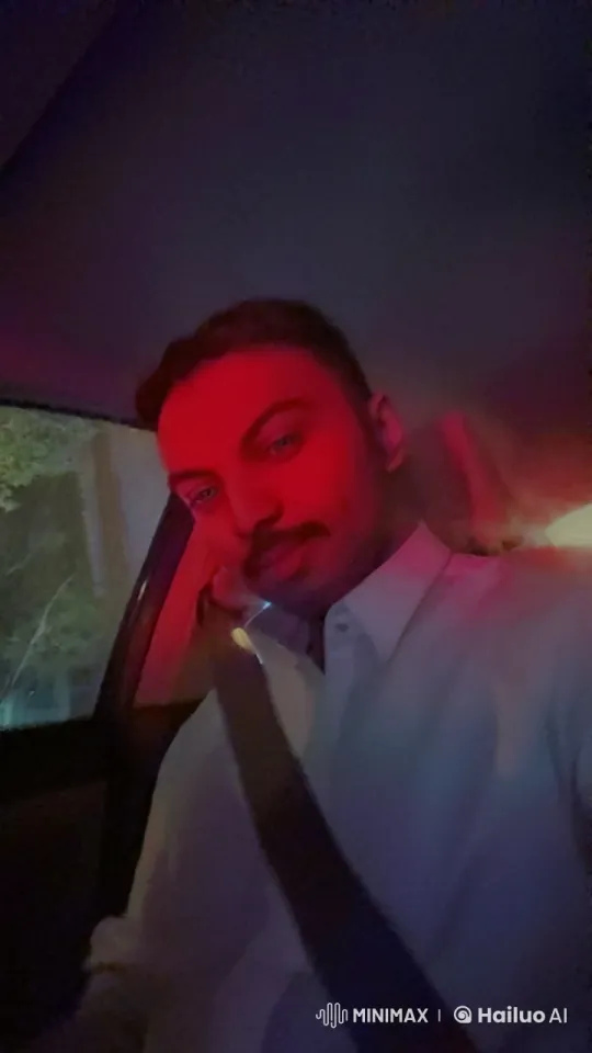Nighttime Reflection: Solitary Figure Smoking in Car – AI Generated Video | Hailuo AI