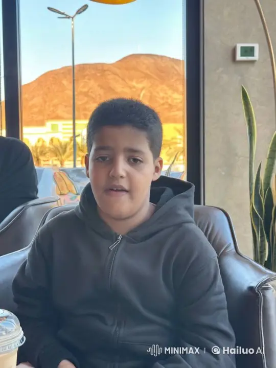 Contemplative Youth in Cozy Café with Mountain View – AI Generated Video | Hailuo AI