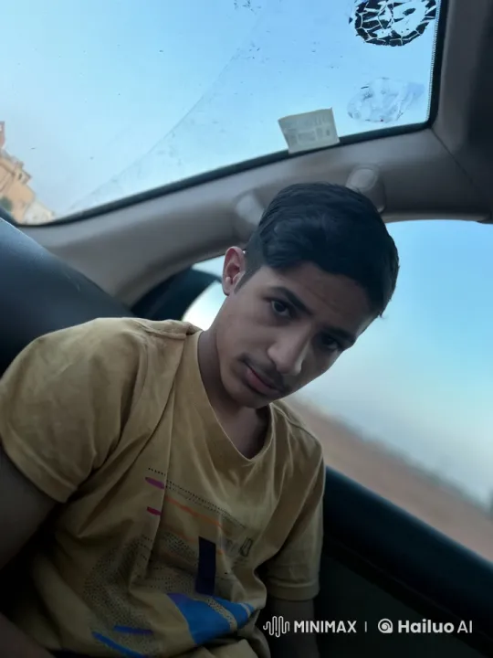 Contemplative Youth in Moving Car Smoking – AI Generated Video | Hailuo AI